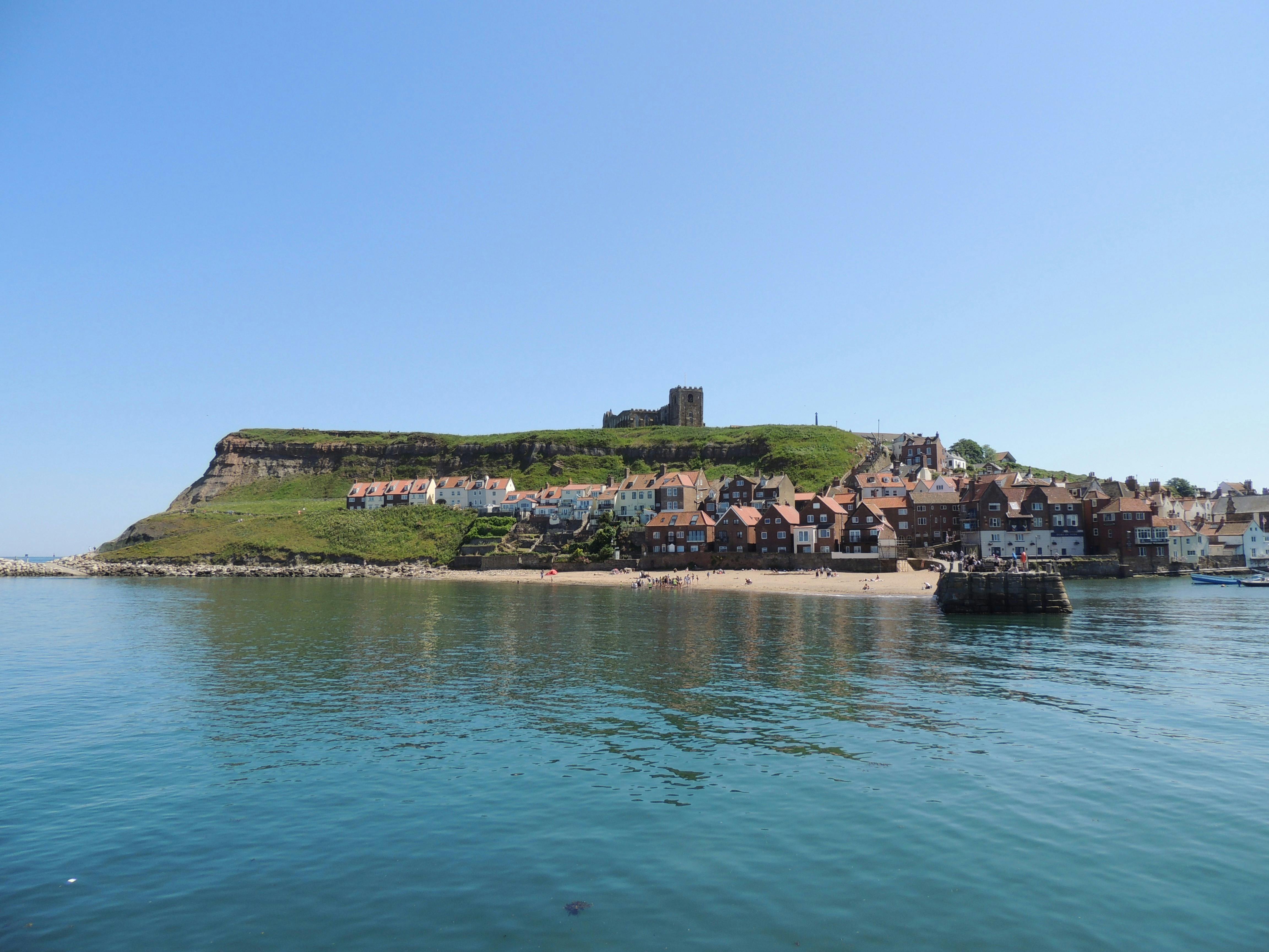 Coastal seaside town with harbor and historic architecture